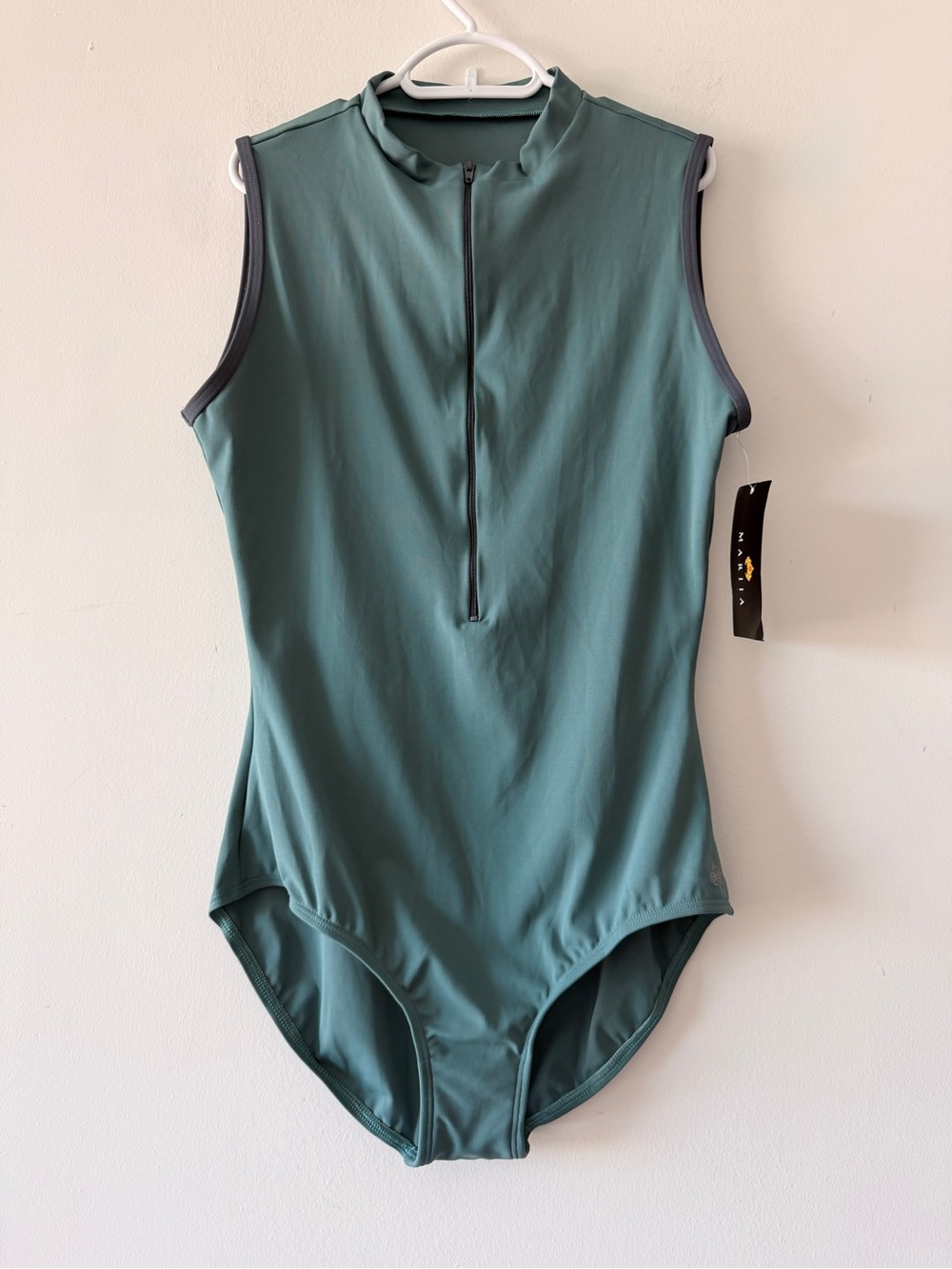 Mariia‎ M2 sleeveless leotard features a high neck and a functional front zipper